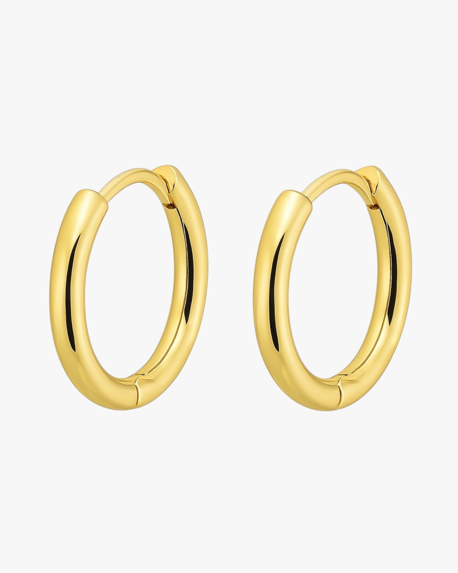 Gold hoop earrings on a white background