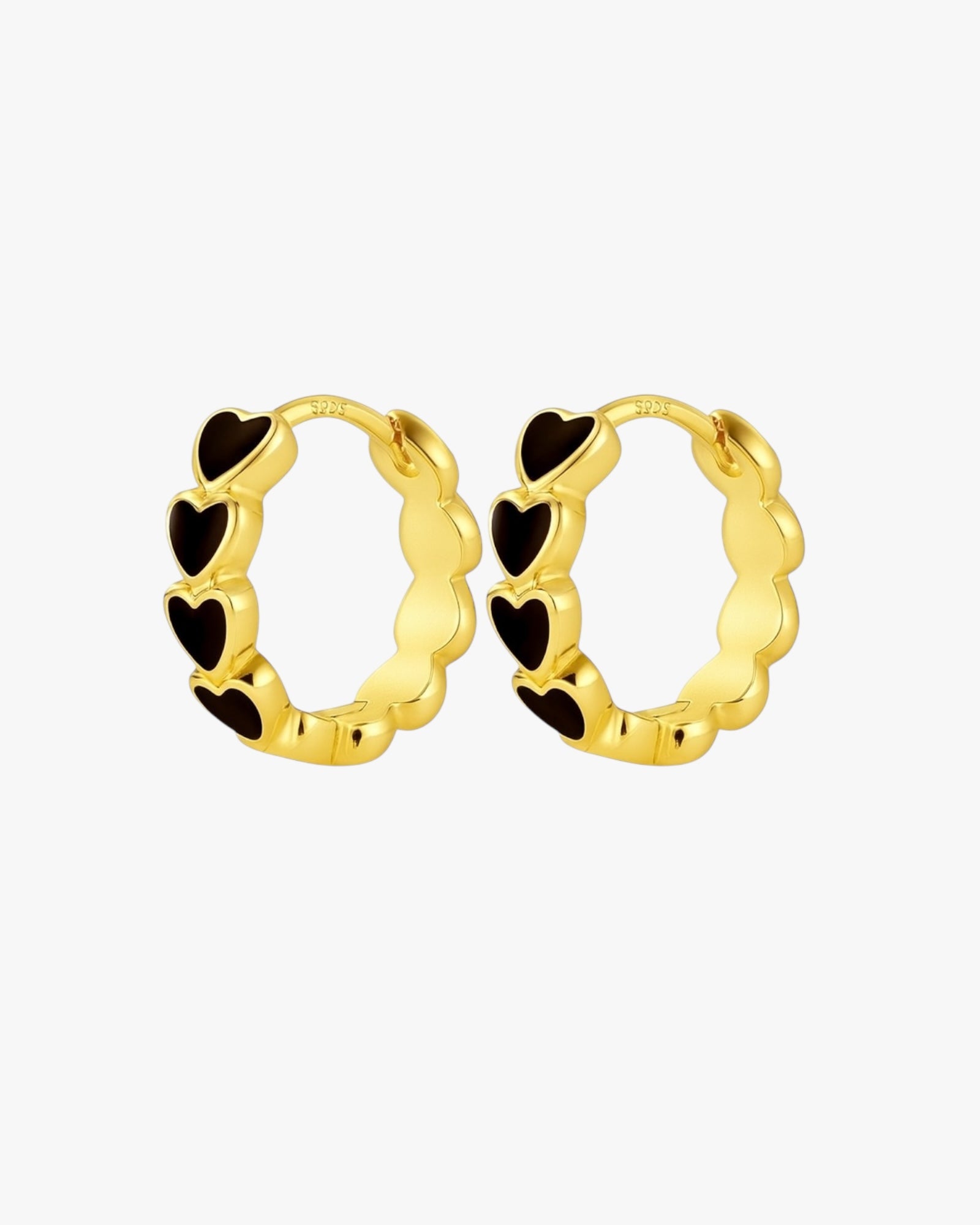 Gold hoop earrings with black heart designs on a white background