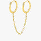 Gold hoop earrings with chain extensions on a white background