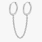 Silver hoop earrings with a chain on a white background