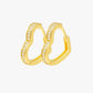 Gold hoop earrings with embedded stones on a white background