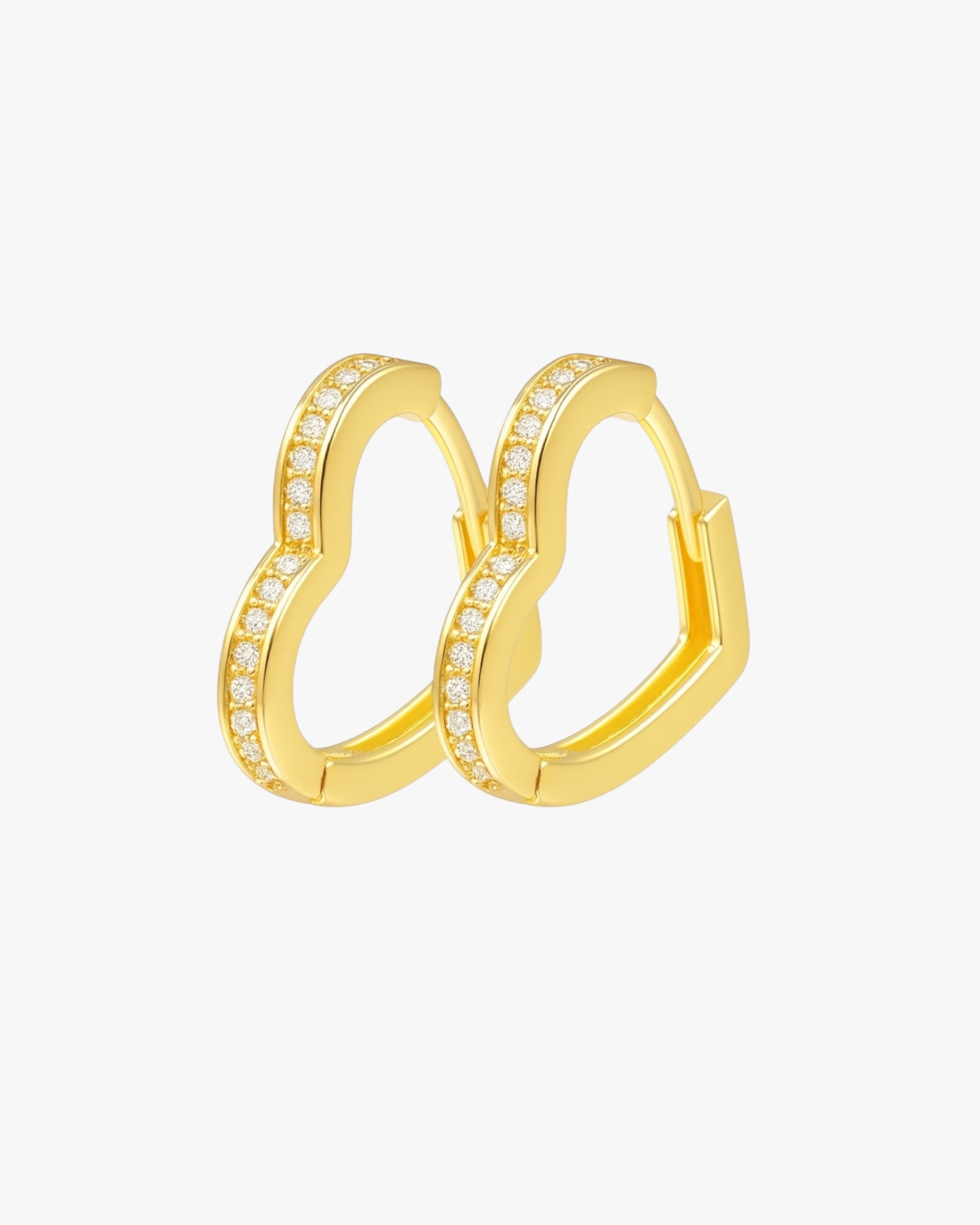 Gold hoop earrings with embedded stones on a white background