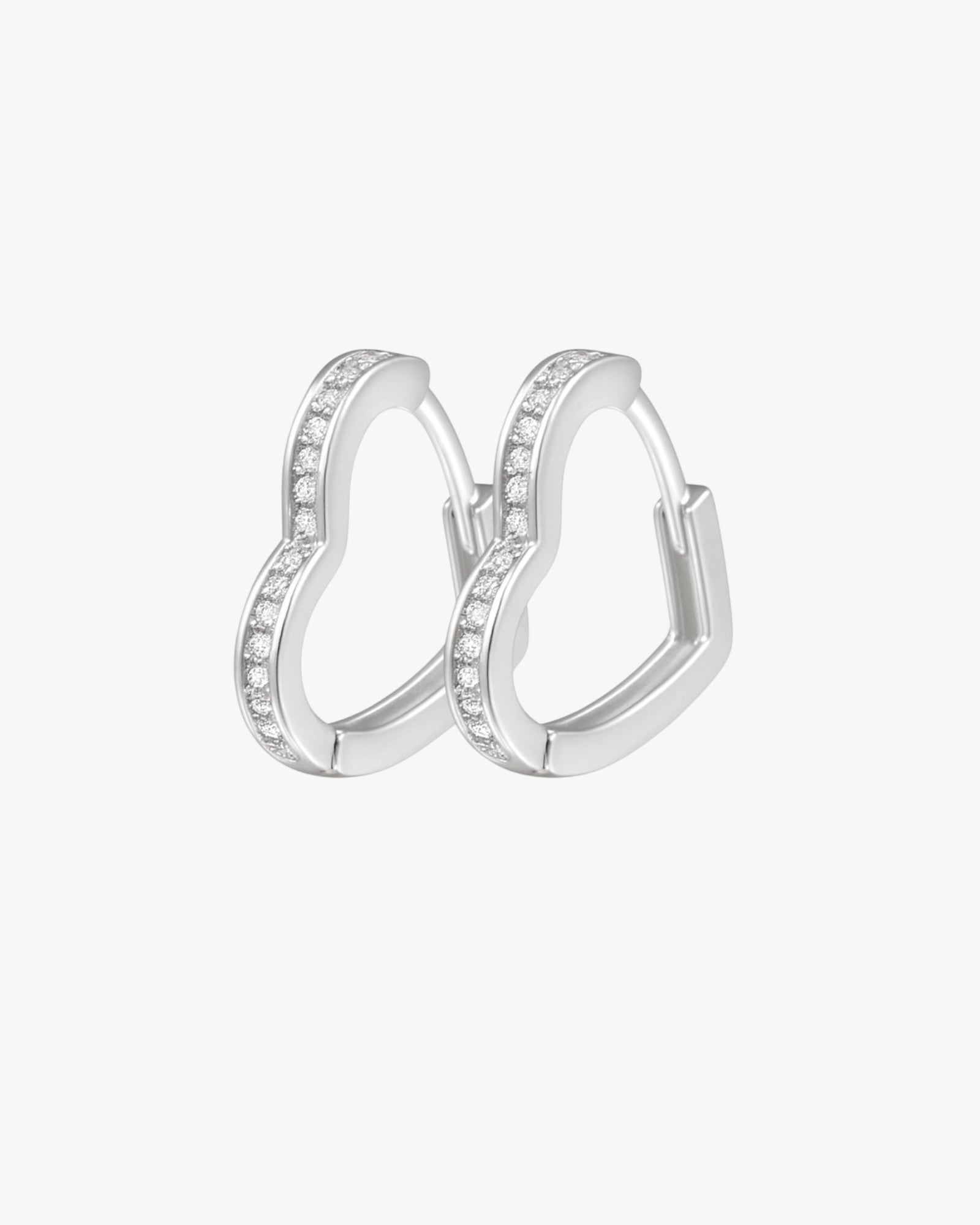 Pair of silver hoop earrings with small stones on a white background