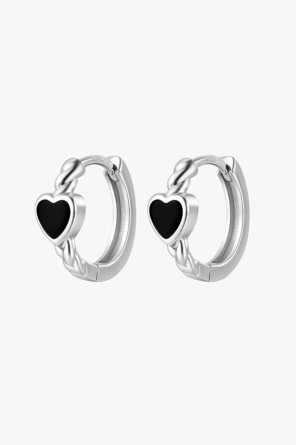 Silver hoop earrings with black heart stones on a white background