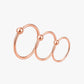 Rose gold hoop earring on a white background