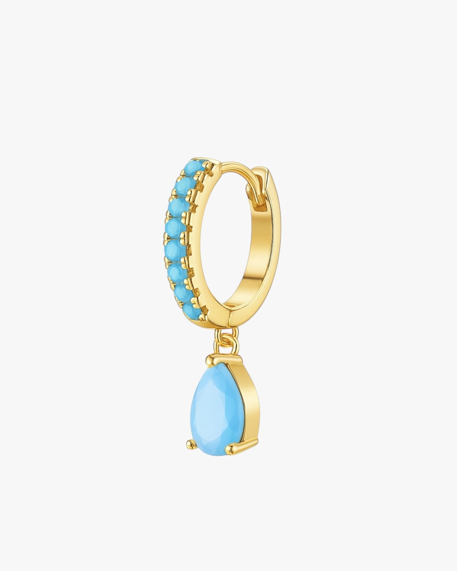 Gold hoop earring with turquoise stones on a white background