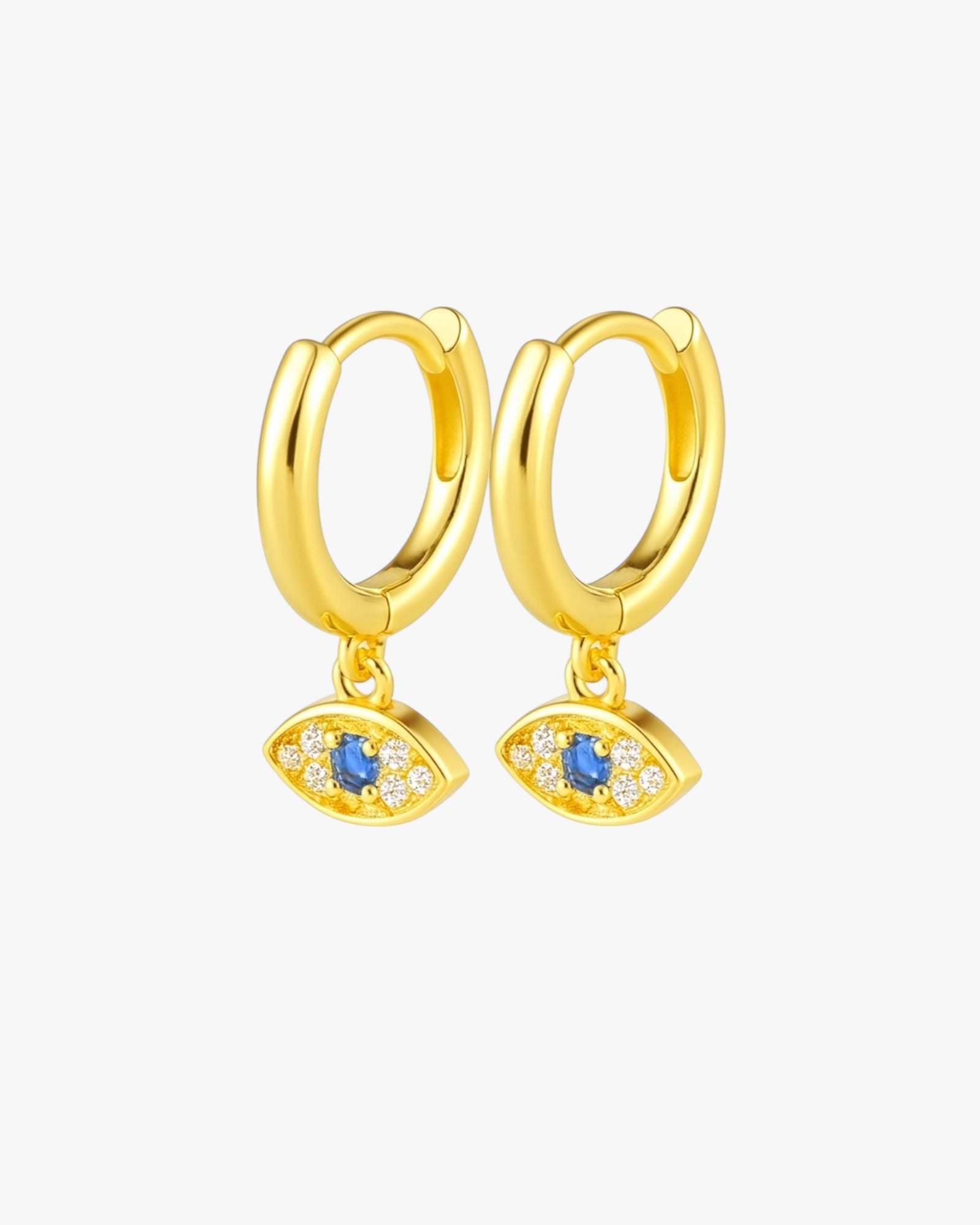 Gold hoop earrings with eye-shaped charms on a white background