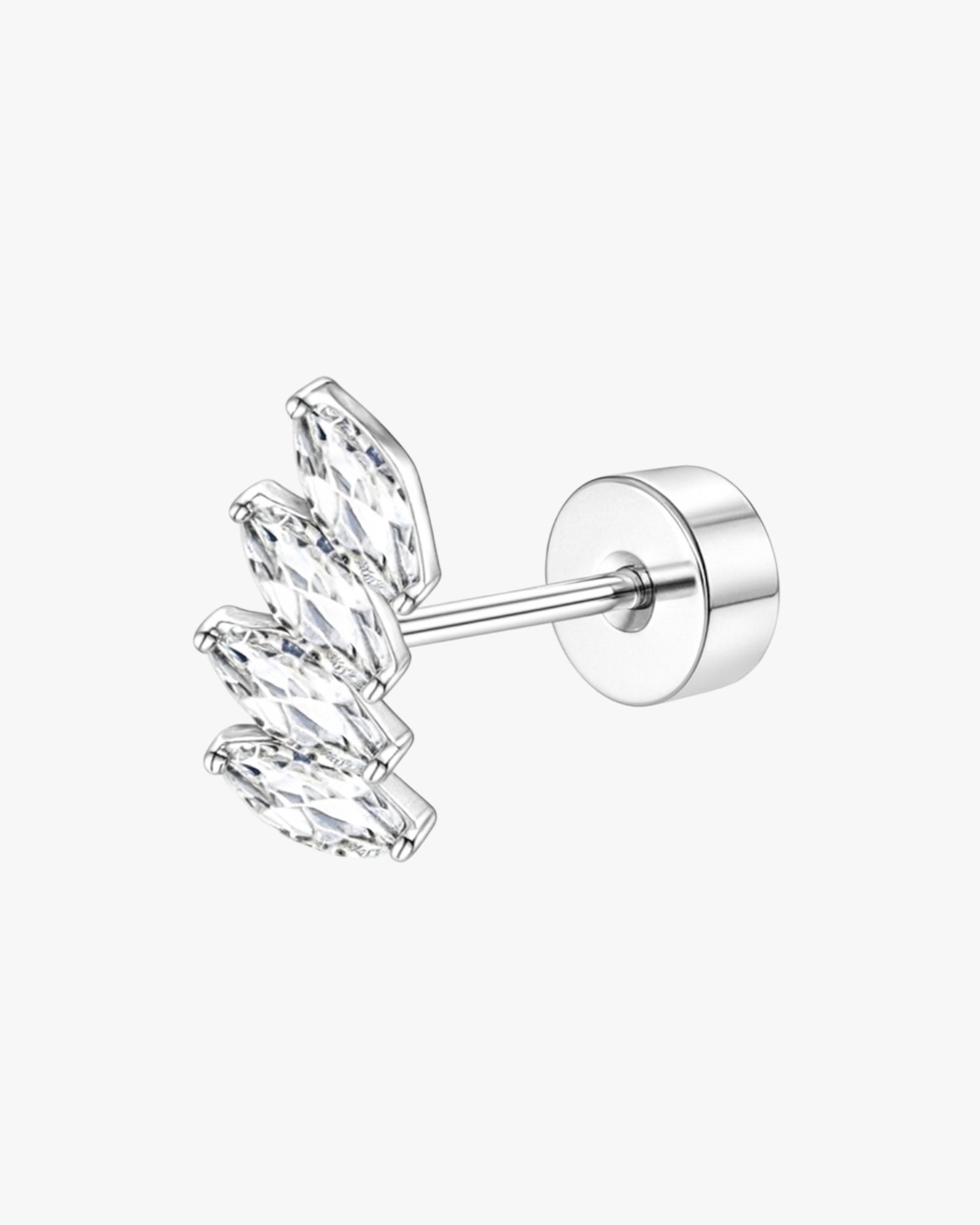 Silver earring with clear gemstones on a white background