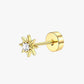 A single gold-colored stud earring with a star shape and a small clear stone at the top.