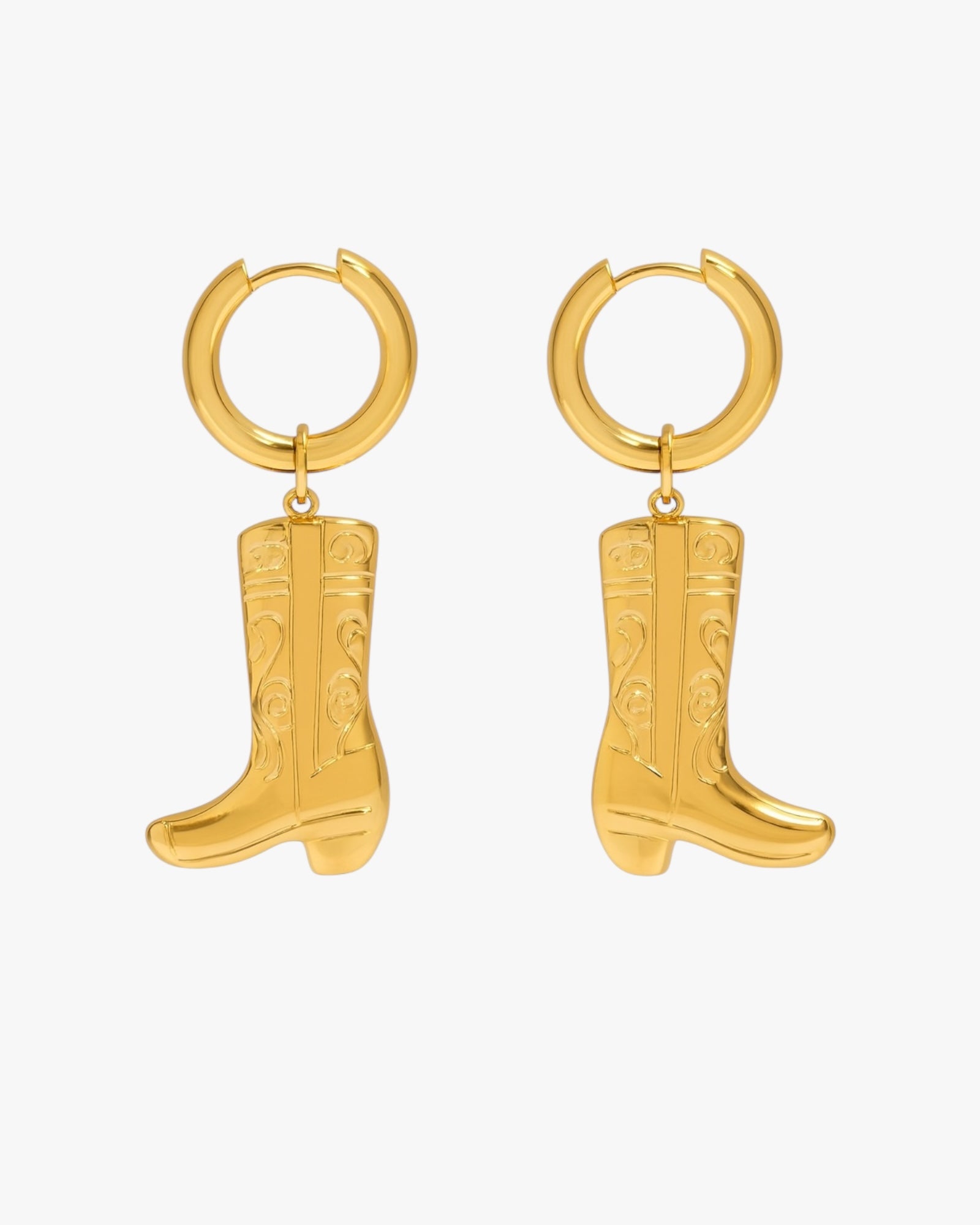 Gold hoop earrings with cowboy boot charms on a white background