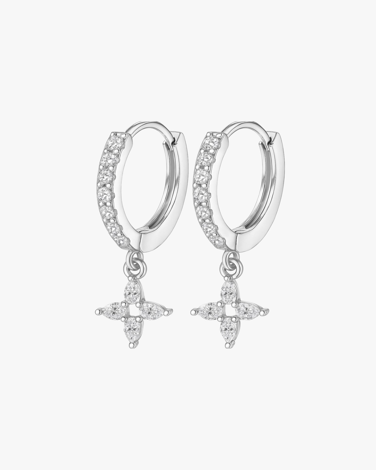 Silver hoop earrings with star-shaped charms on a white background