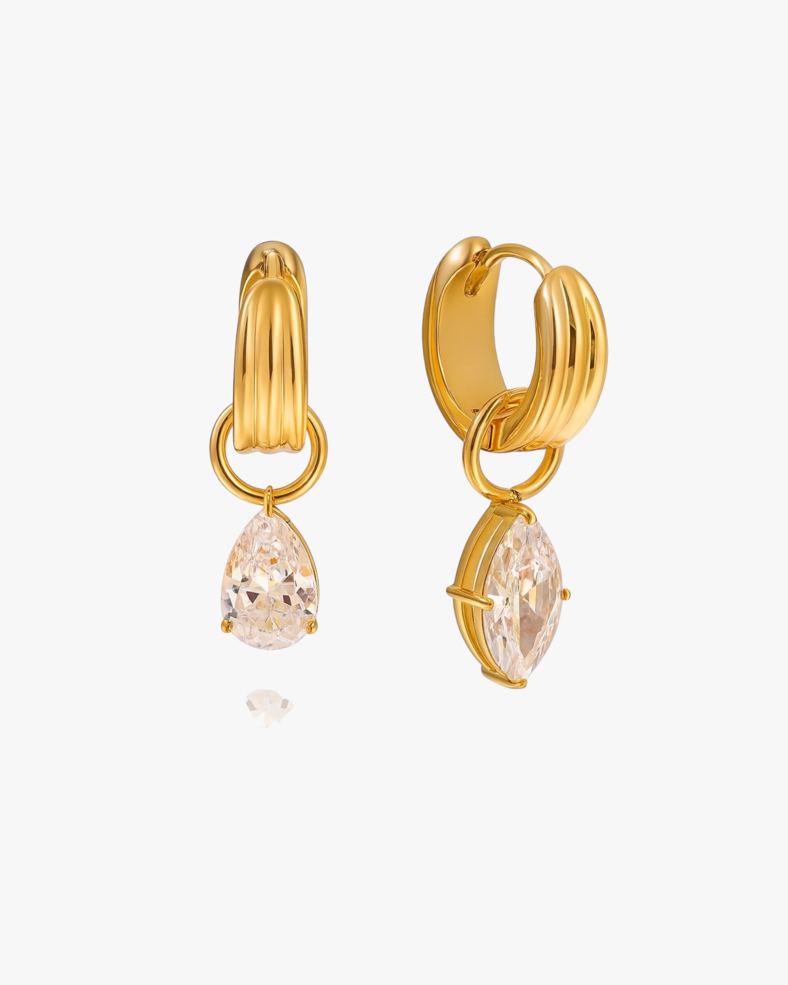 Gold hoop earrings with teardrop-shaped gemstones on a white background