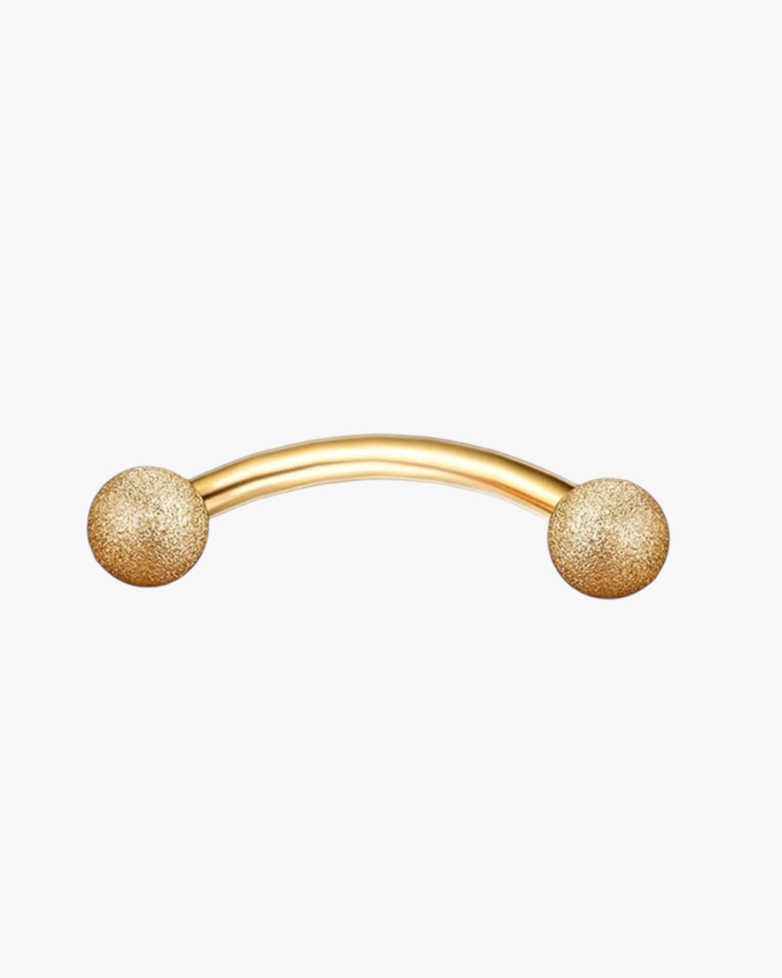 A gold-colored curved barbell with two spherical adornments on the ends.