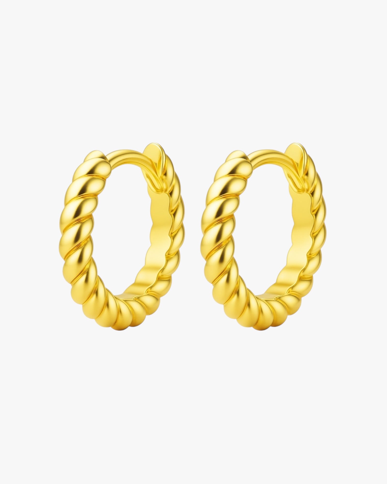 Pair of gold hoop earrings on a white background