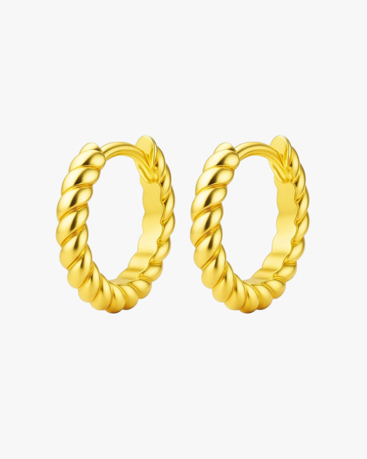 Pair of gold hoop earrings on a white background