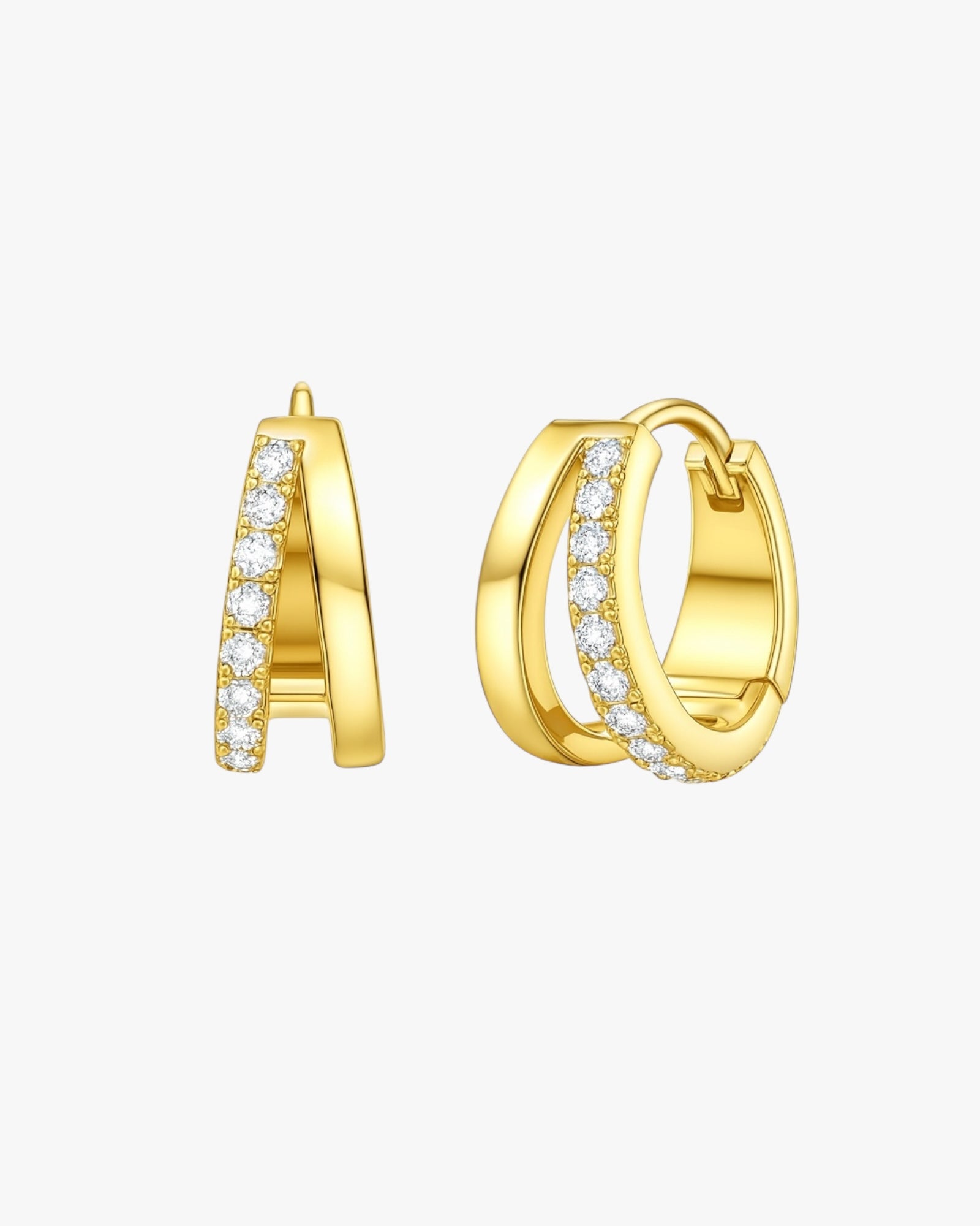 Gold hoop earrings with embedded diamonds on a white background