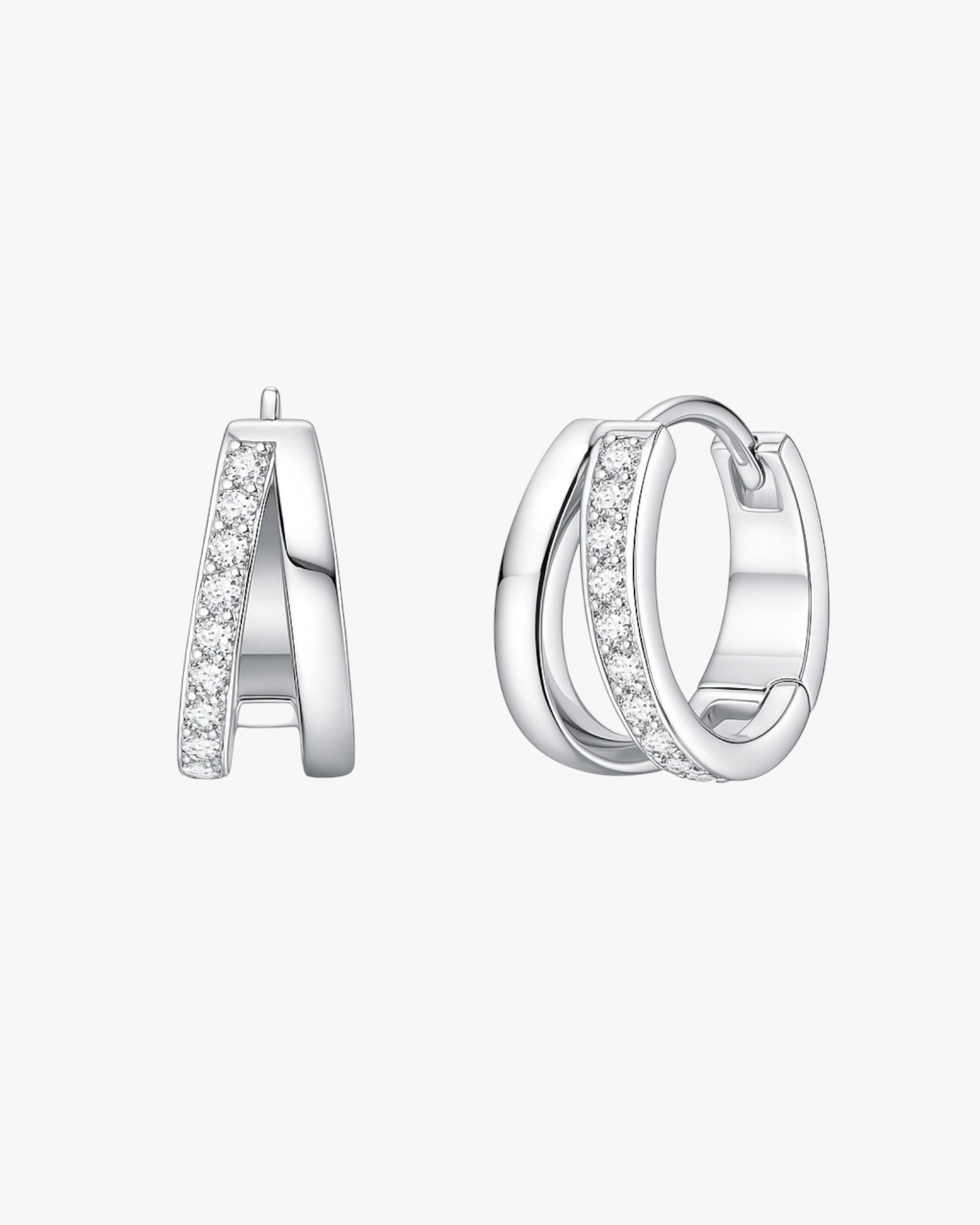 Silver hoop earrings with embedded stones on a white background