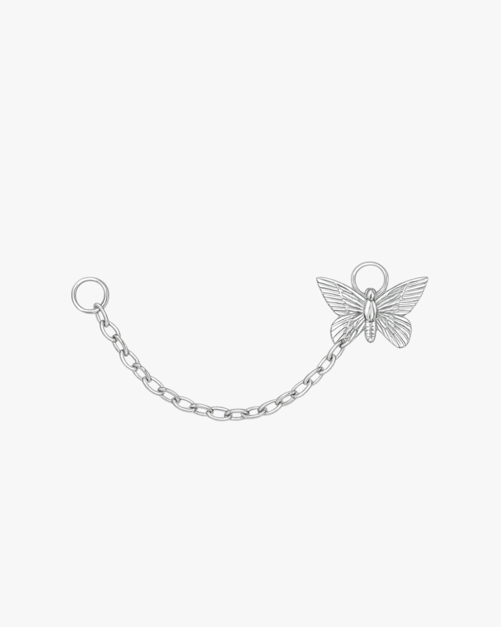 Silver chain with a butterfly charm on a white background