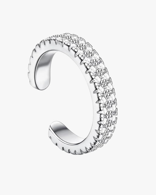 A gold-plated brass cuff with zirconia stones set around its circumference.