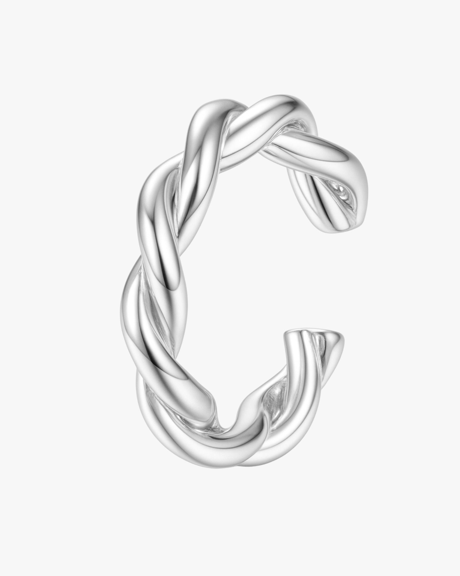 Silver twisted ear cuff on a white background