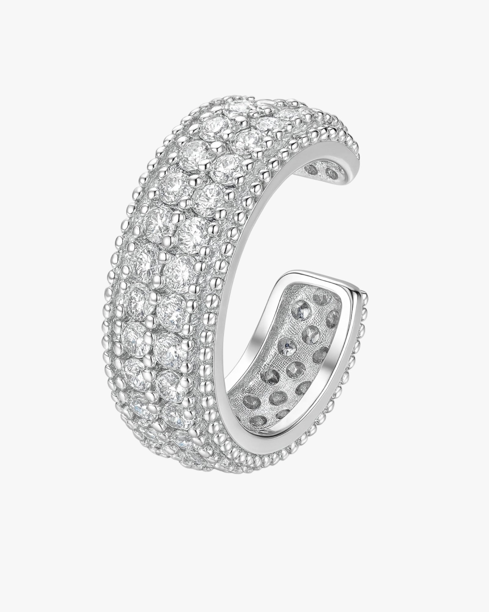 Silver ring with diamond-like stones on a white background