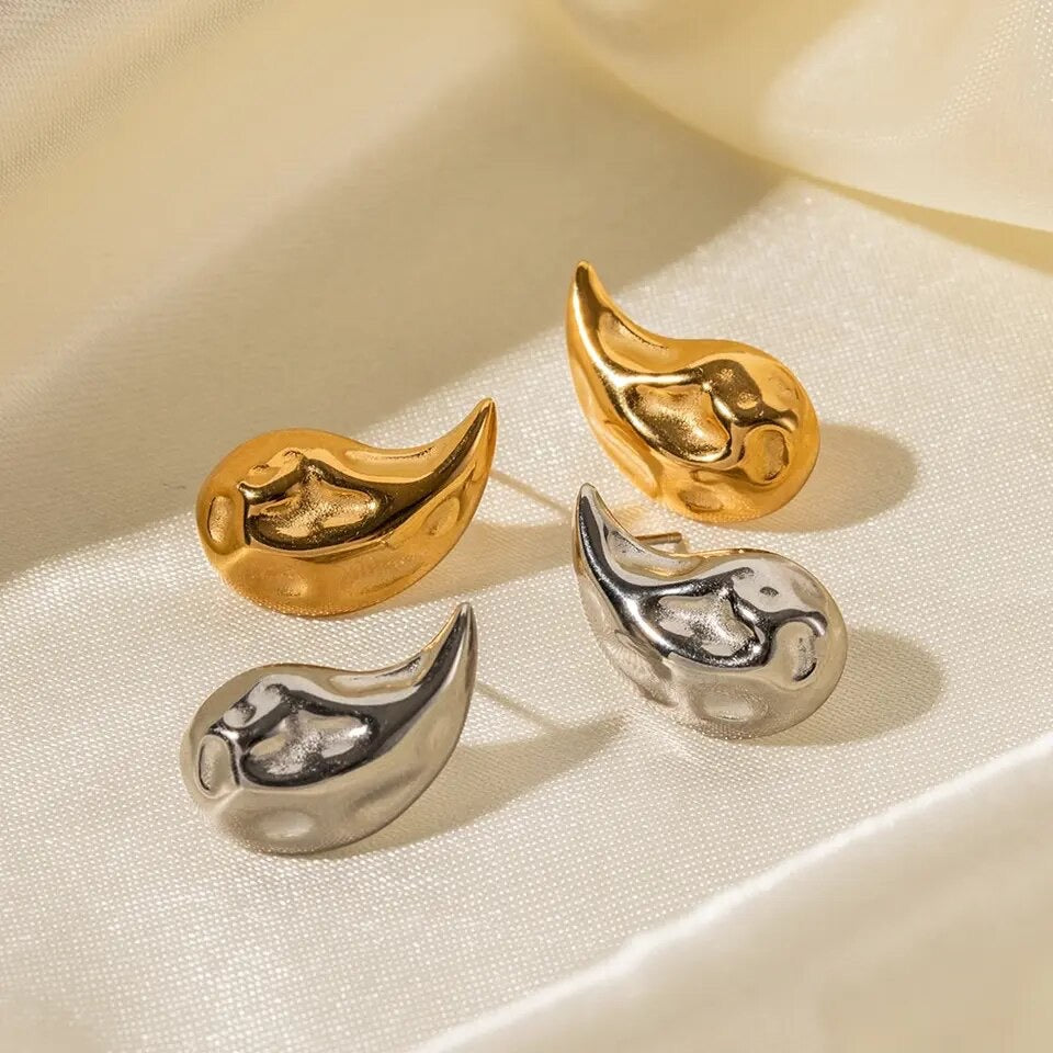 "Image: Two pairs of gold drop earrings, each radiating elegance and style."