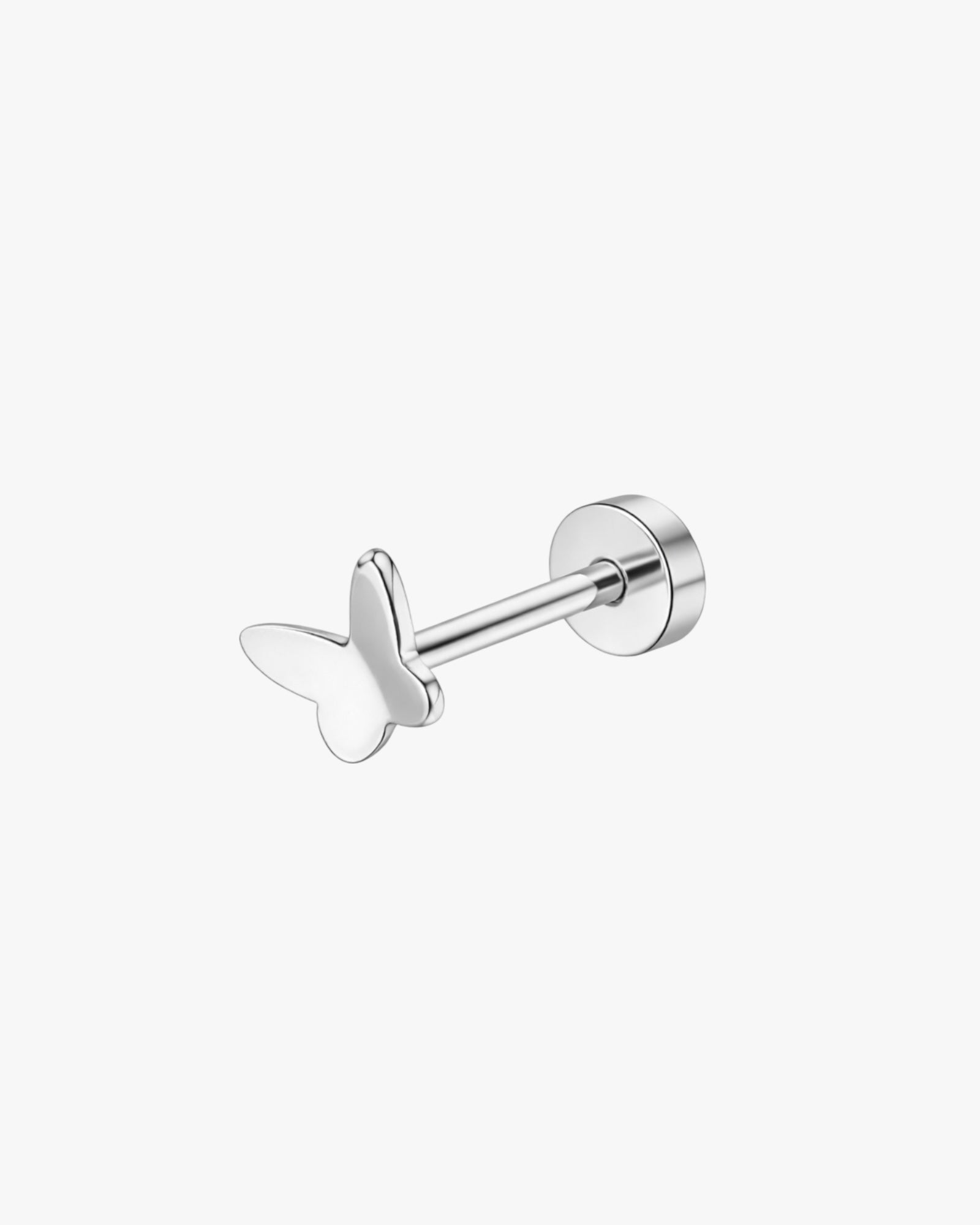 Butterfly-shaped silver earring on a white background