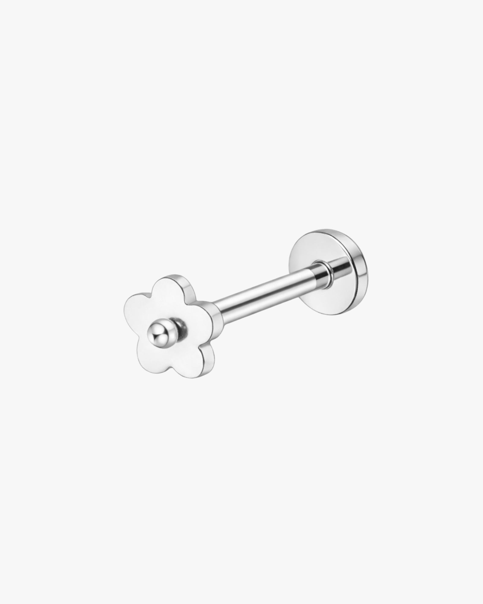 silver flower-shaped stud  on a white background