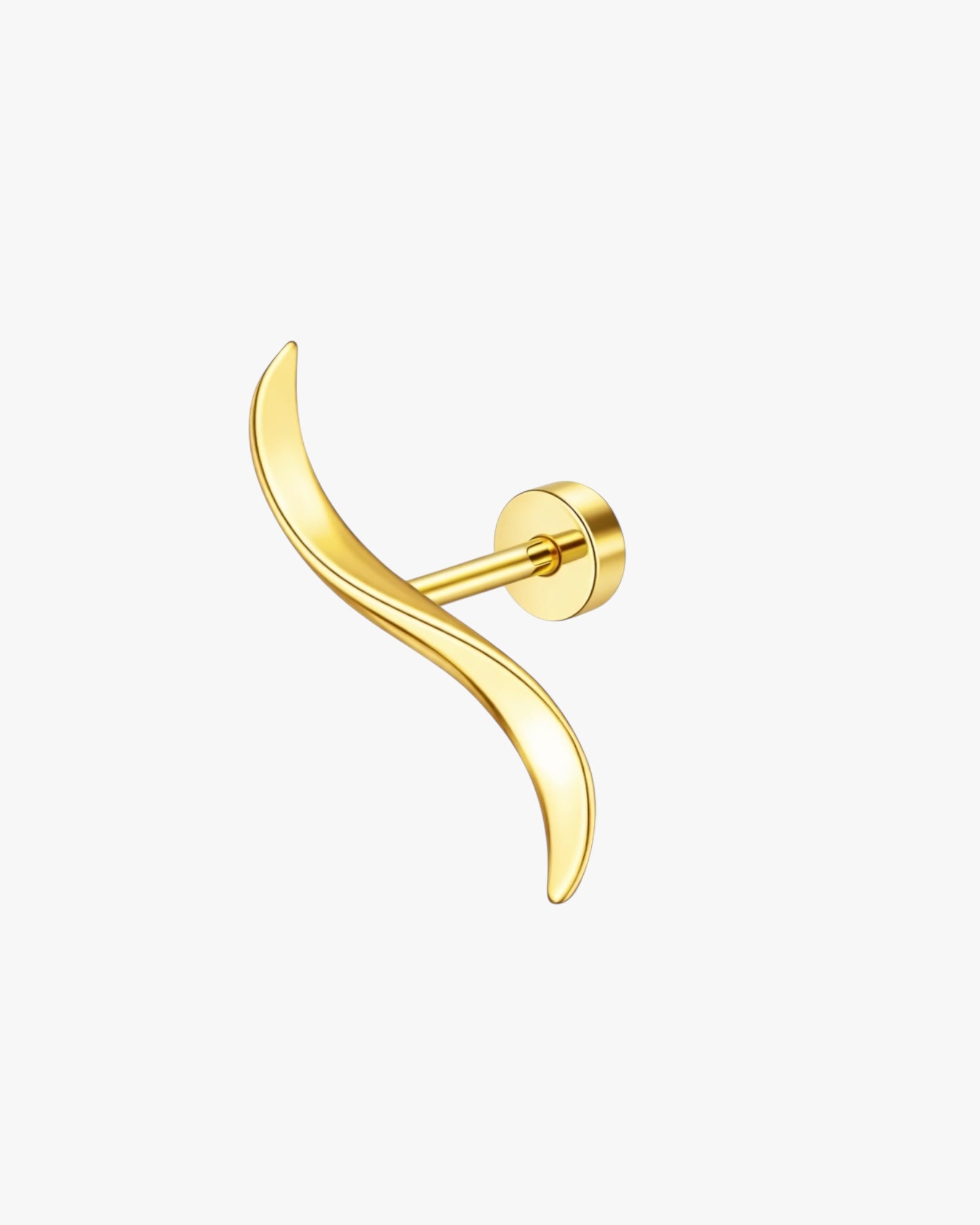 Gold earring on a white background