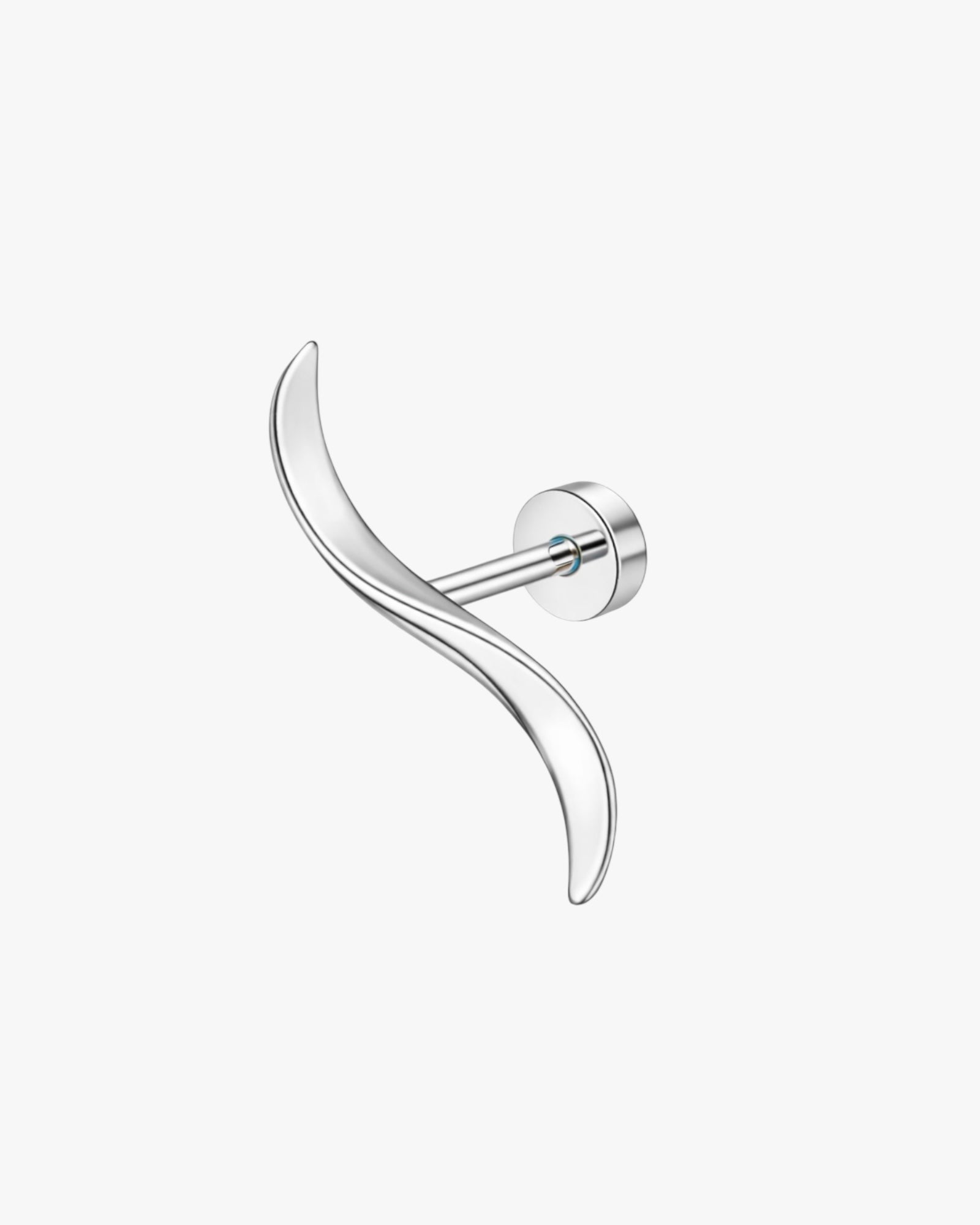 Silver earring with a curved design on a white background