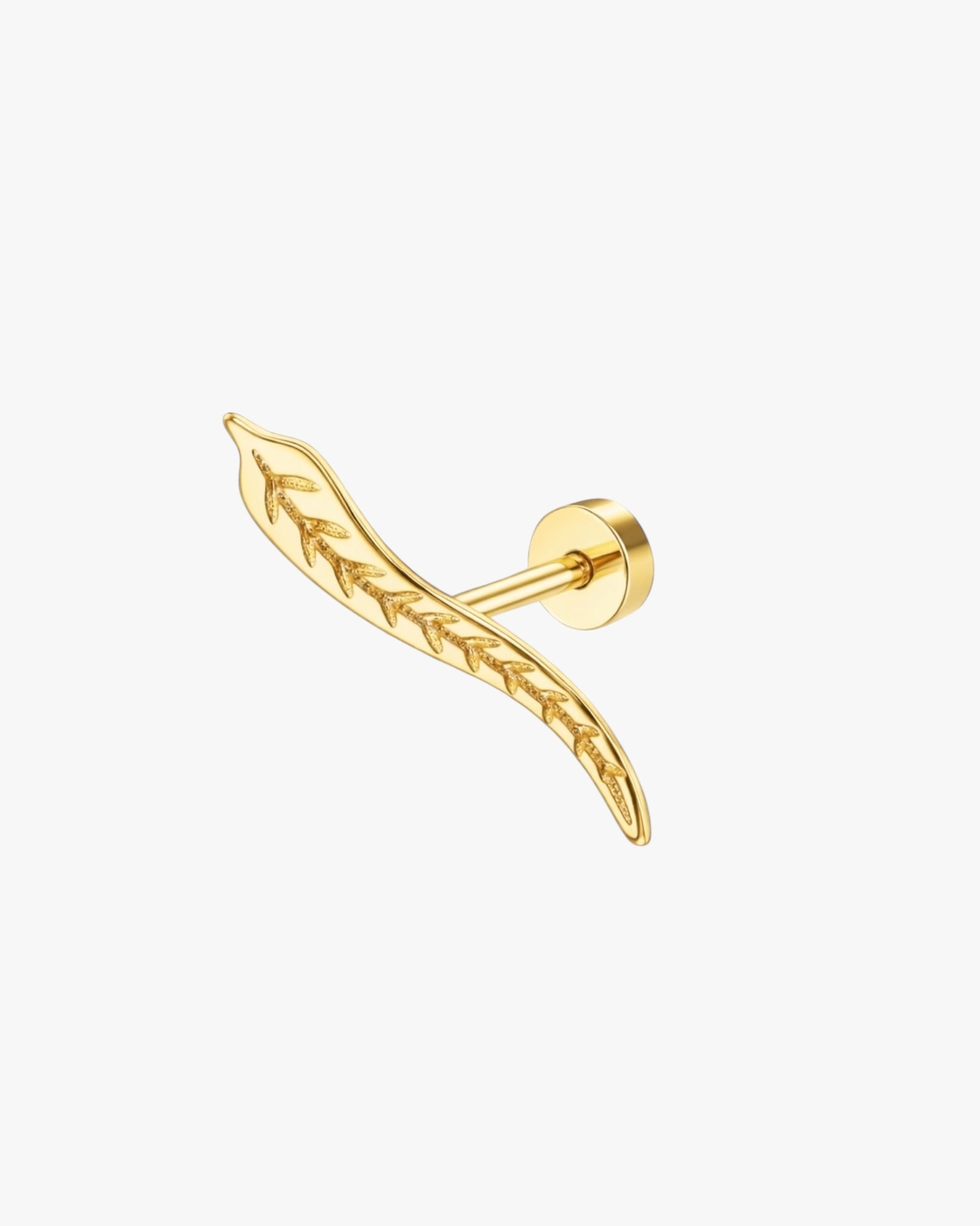 Gold feather-shaped earring on a white background
