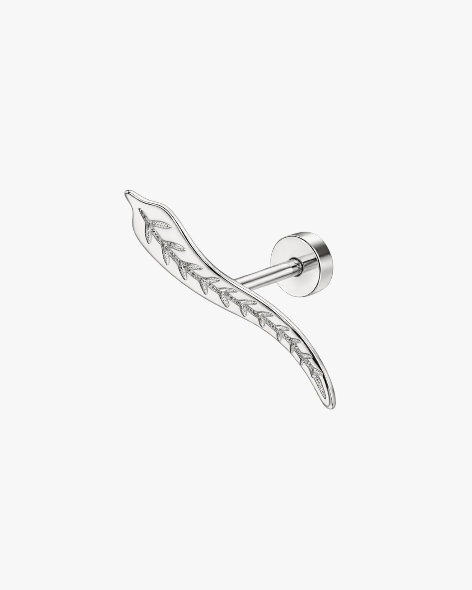 Silver earring with a leaf design on a white background