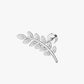 Silver leaf-shaped earring with clear gemstones on a white background