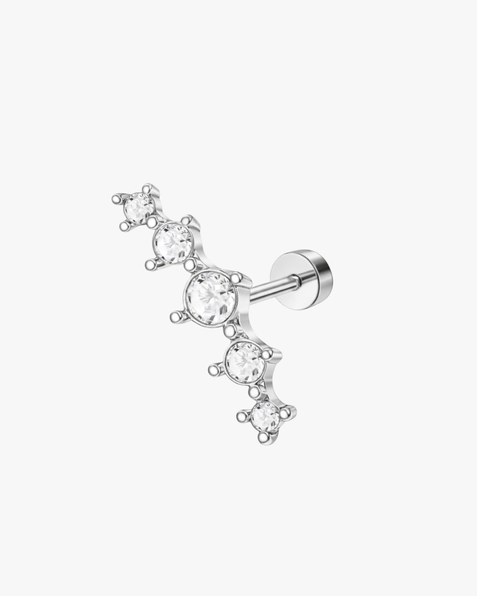 Silver earring with clear gemstones on a white background