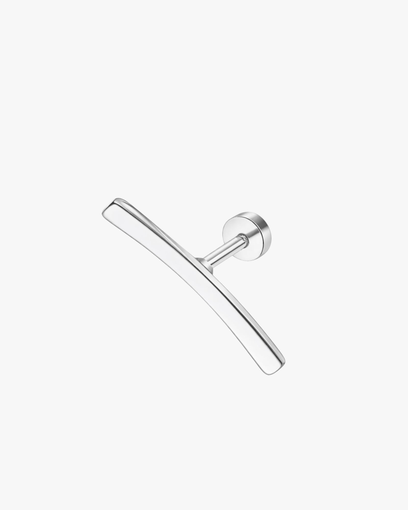 silver ear stud on a white background