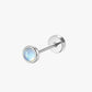 Single stud earring with a moonstone gemstone on a white background