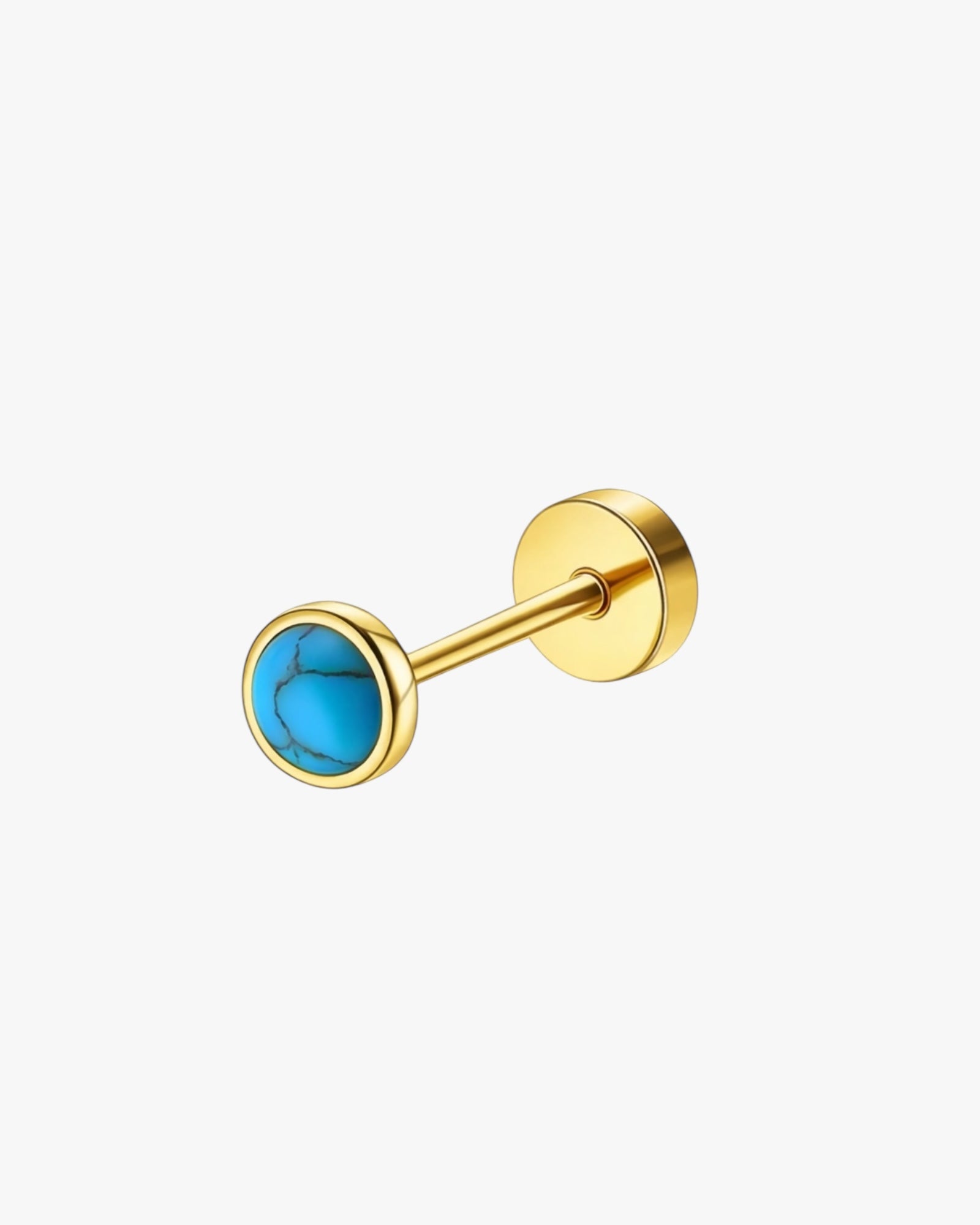 Gold stud earring with a blue gemstone on a white background