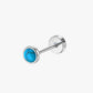 Single stud earring with turquoise gemstone on a white background