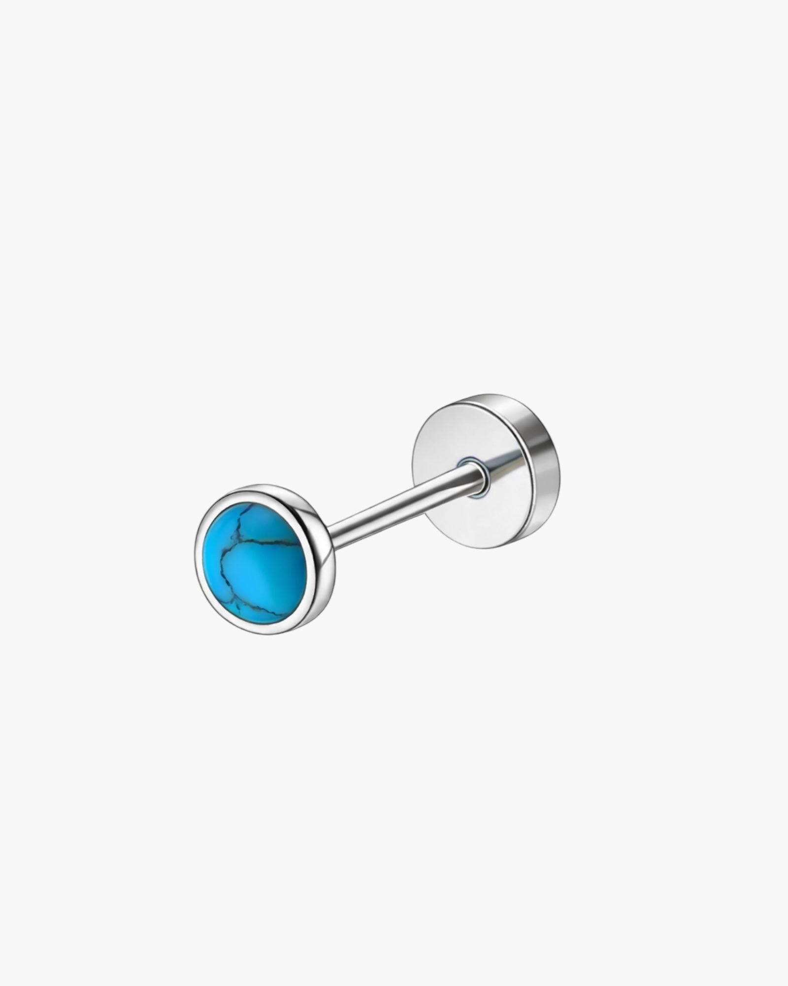 Single stud earring with turquoise gemstone on a white background