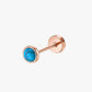 Rose gold stud earring with turquoise gemstone on a white background