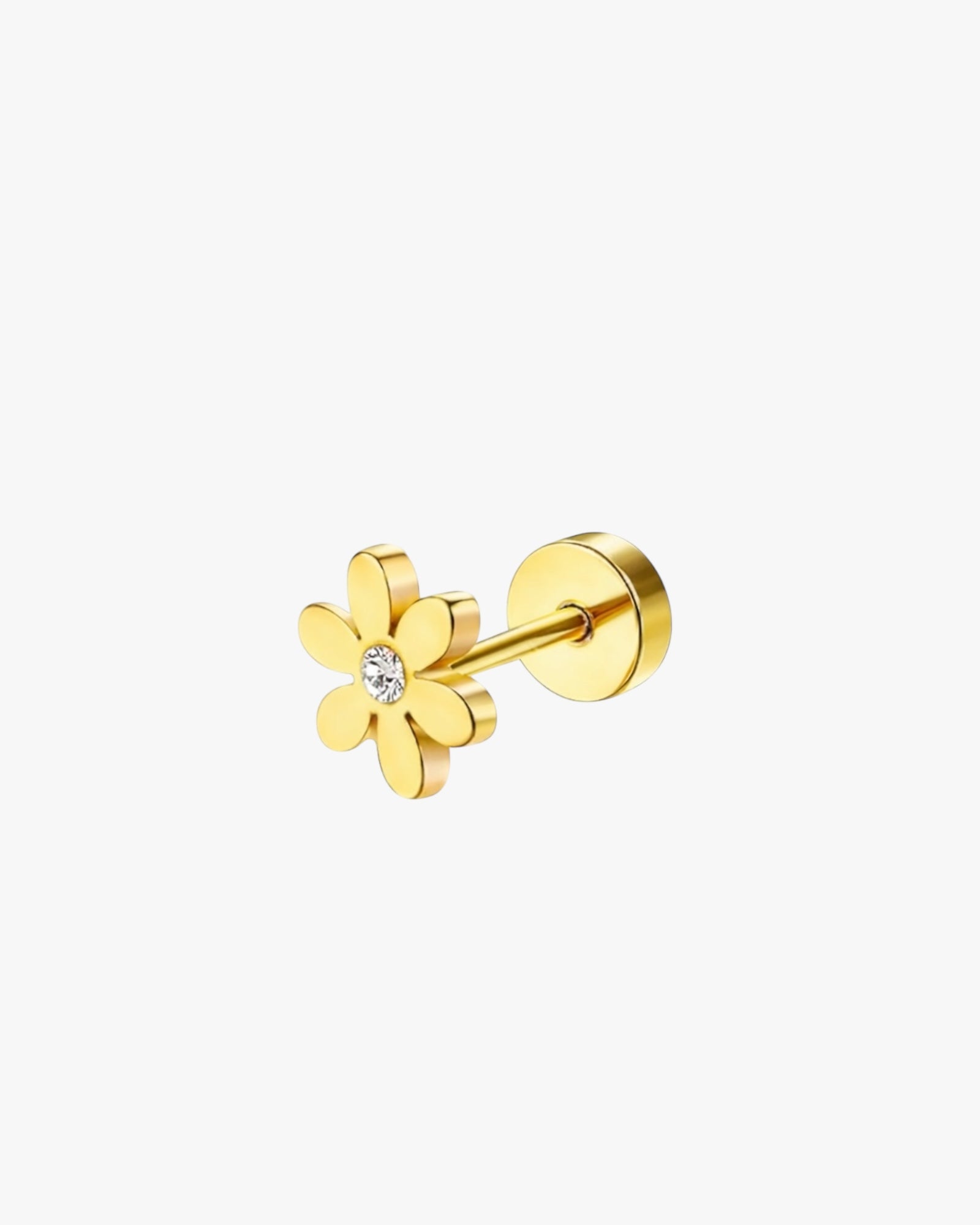 Gold flower-shaped earring on a white background