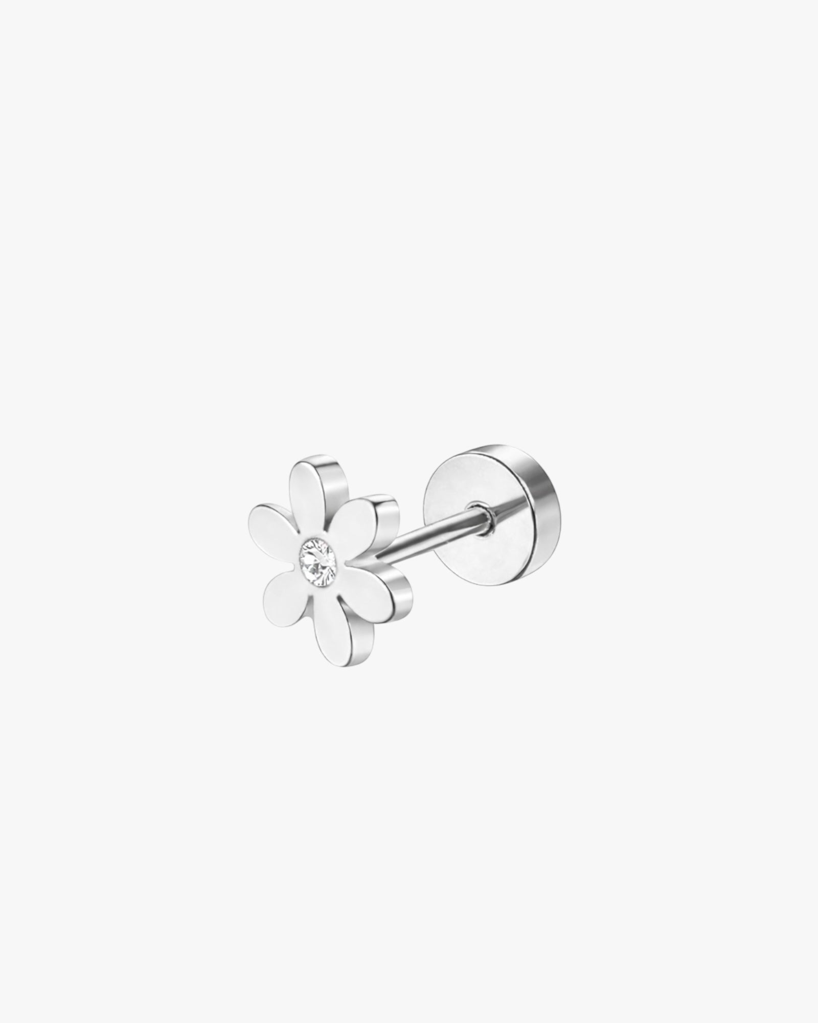 Silver flower-shaped earring on a white background