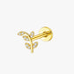 Gold ear cuff with leaf design on a white background
