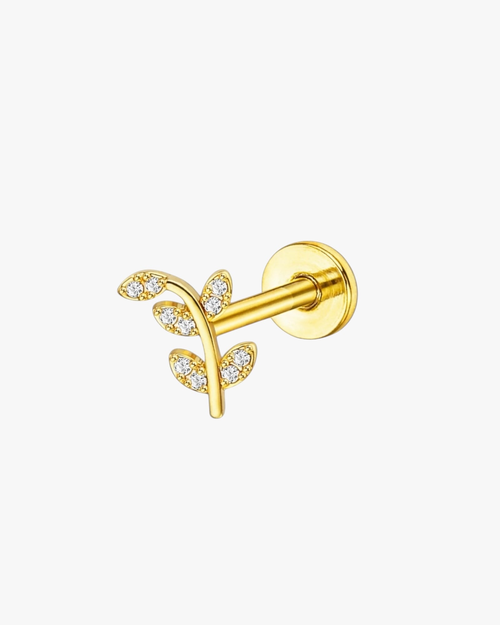 Gold ear cuff with leaf design on a white background