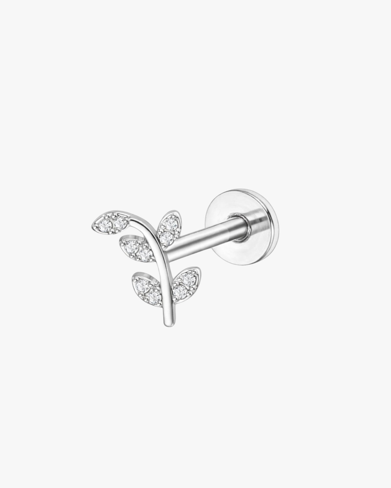 Silver earring with leaf design on a white background