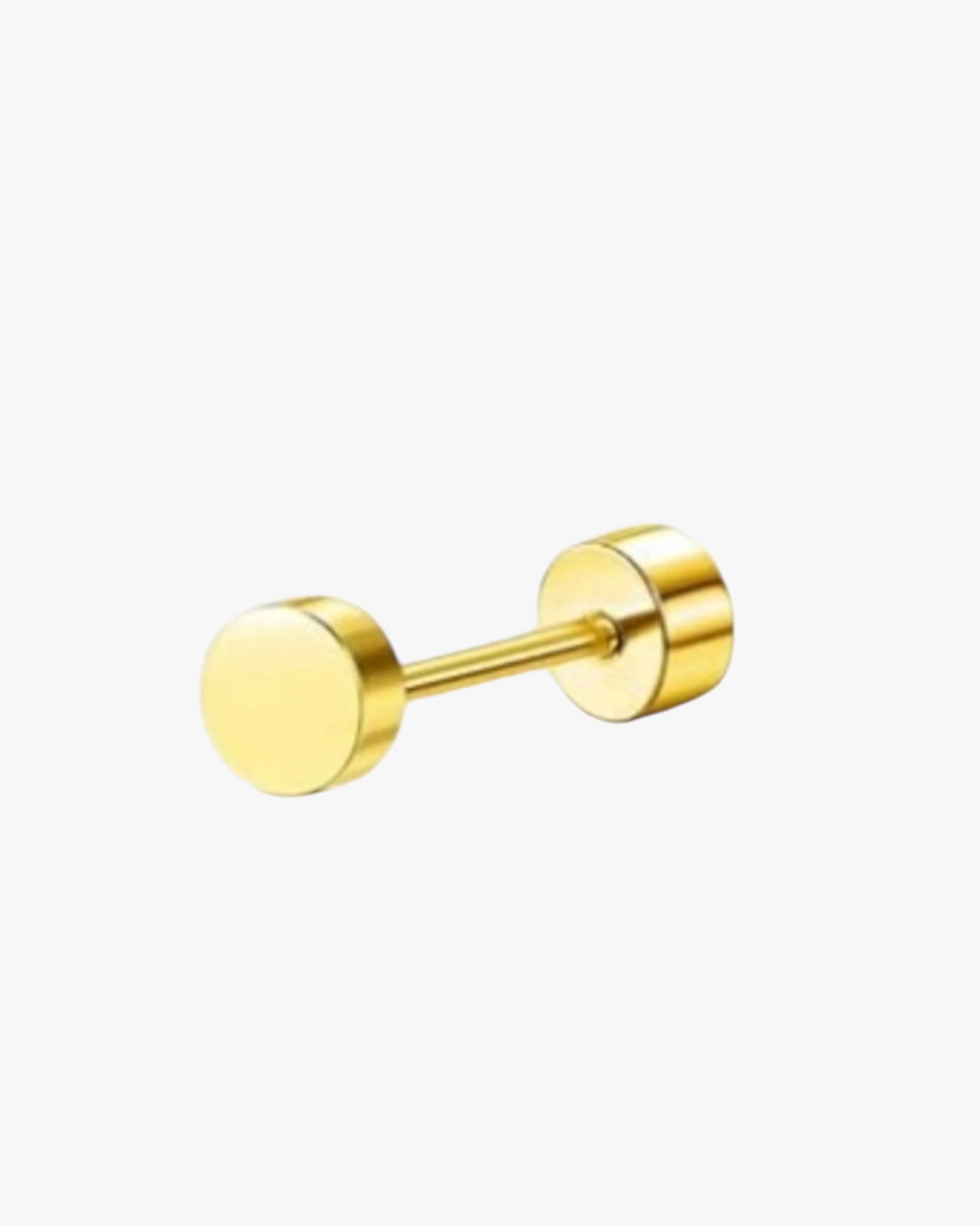 A single gold-colored stud earring with a textured surface.