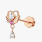 A stud earring with a rose gold-colored band and a central pink gemstone surrounded by smaller clear crystals, with a metallic rose-colored cap on top.