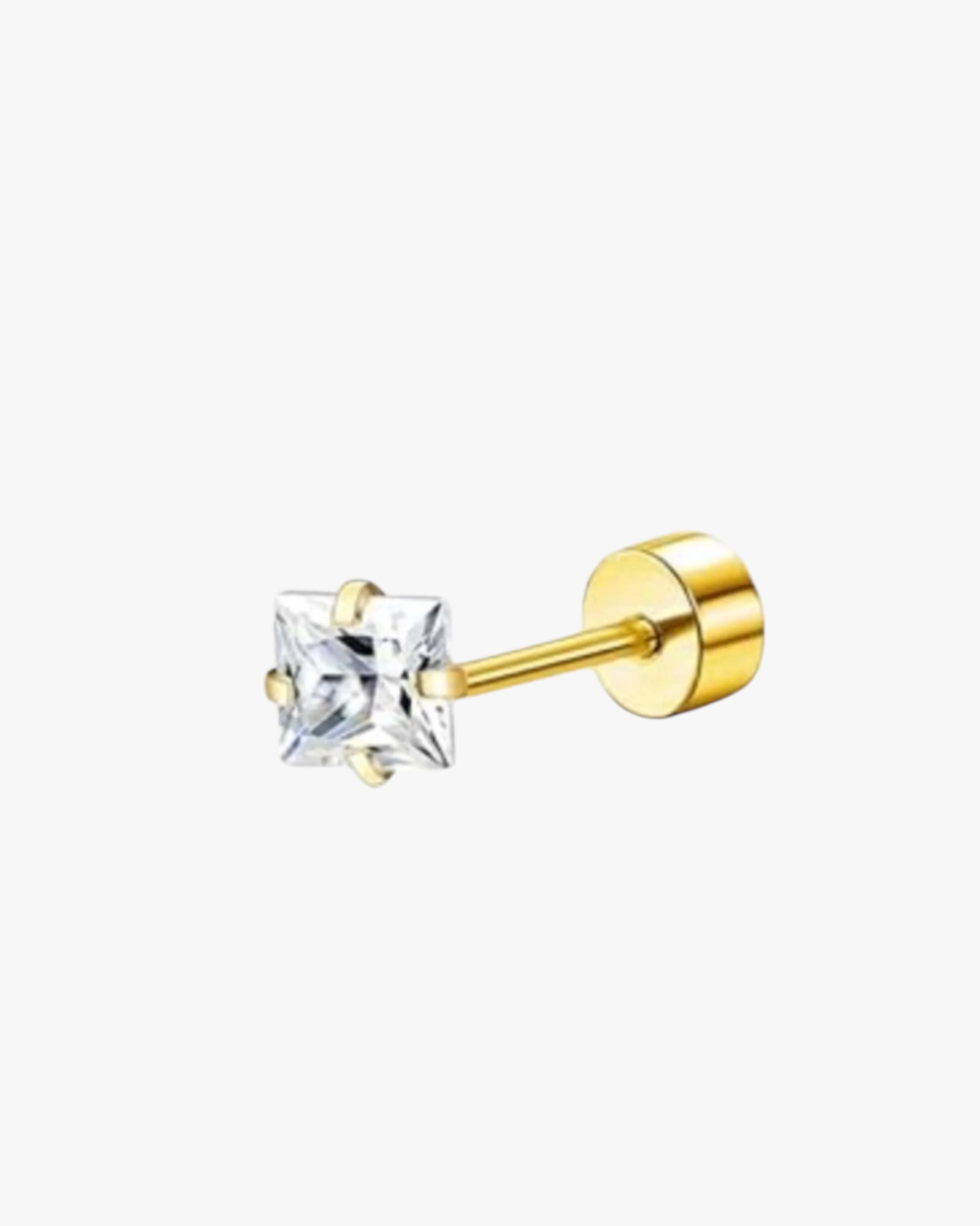A single gold-colored stud earring with a clear square gemstone.