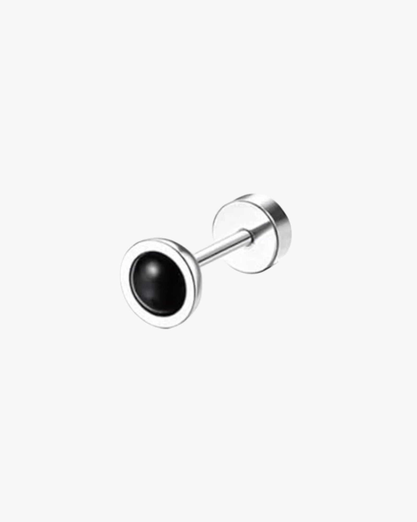 A single silver-colored stainless steel stud earring with a black circular detail on the end.