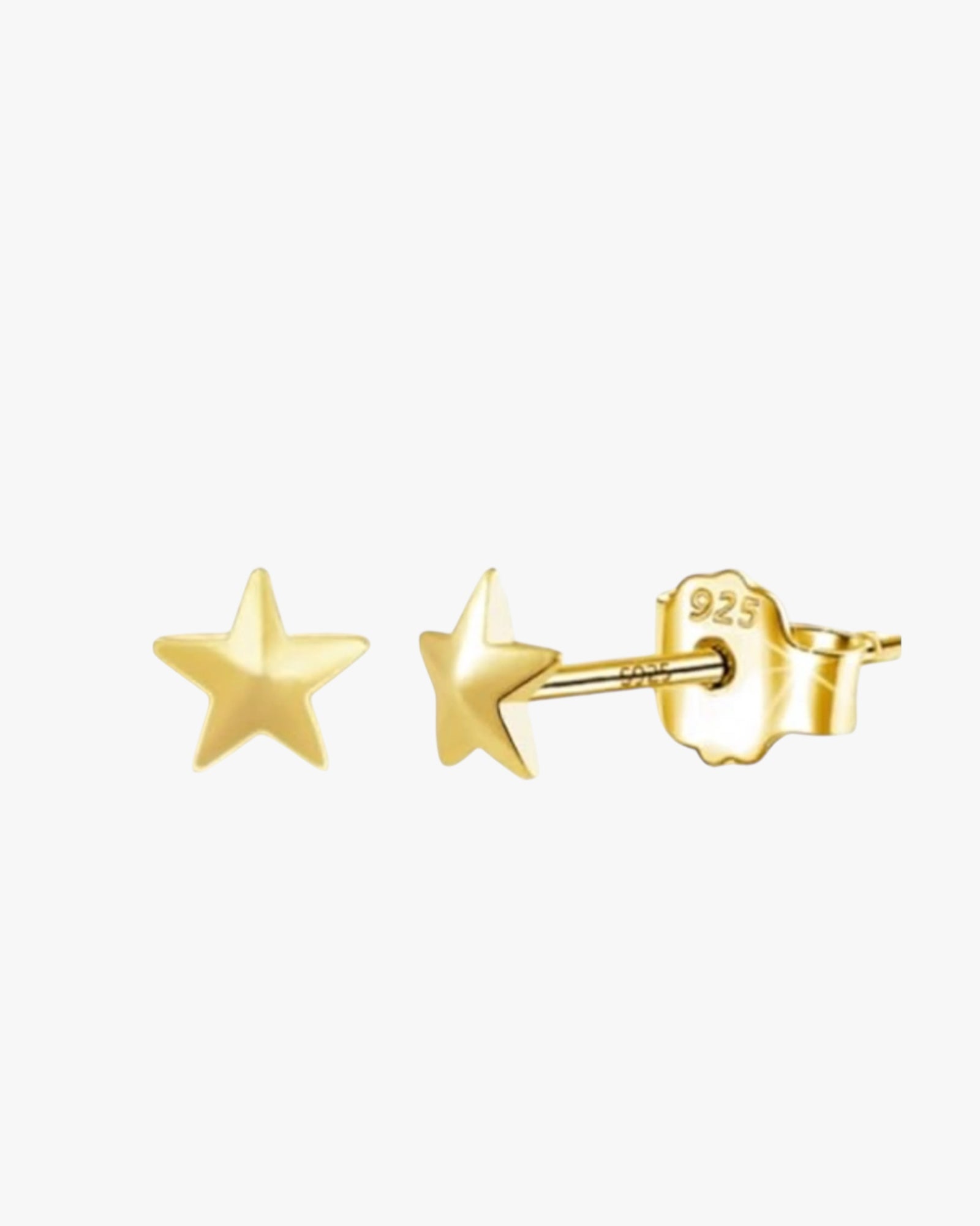 A pair of gold-colored vara earrings with a star-shaped design and a small chain attached to one of the stars.